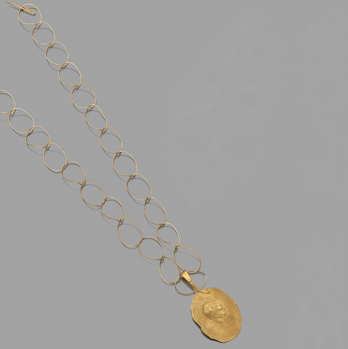 Mario Pinton Necklace in 18K (750) gold, holding a pendant stylizing the profile&hellip;