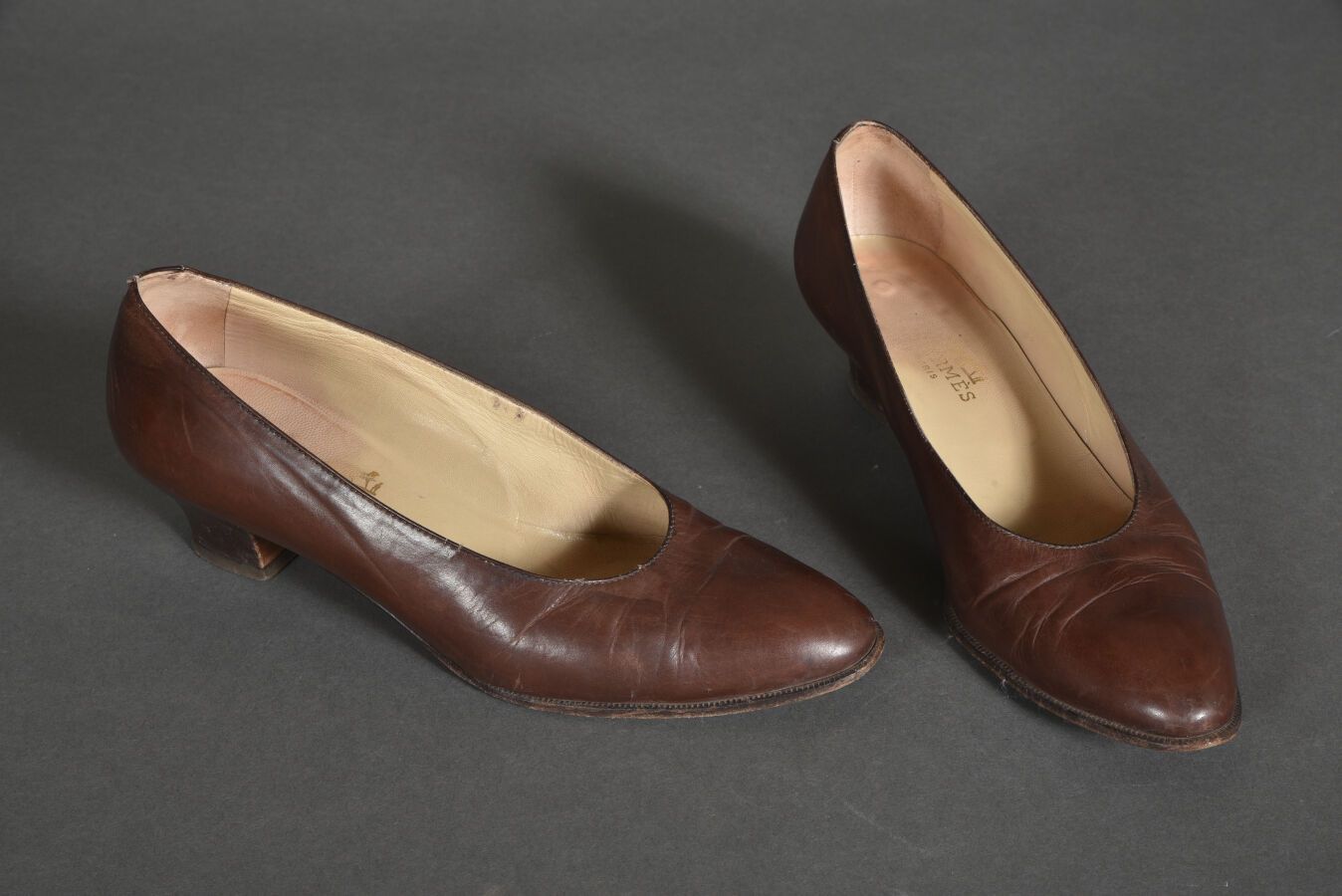 Null HERMES Paris. Pair of brown leather pumps, 3cm coil heel. Size 36,5. Alread&hellip;