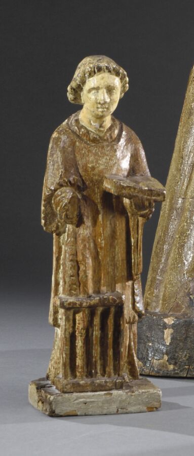 Null 圣洛朗，多色木质雕塑，描绘了圣人携带着他的书和拿着他的殉道的烤架。 
18世纪。 
H.27厘米
损坏。
