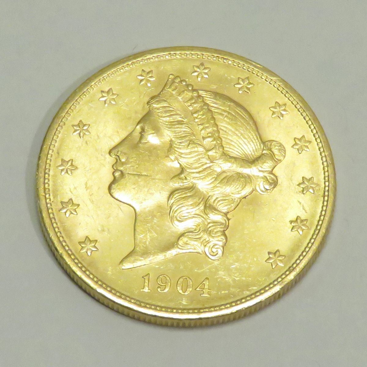 Null 20美元金币 "自由头-双鹰"，日期为1904年，雕刻师：詹姆斯-B。朗克尔。重量：33克45。直径：34mm。