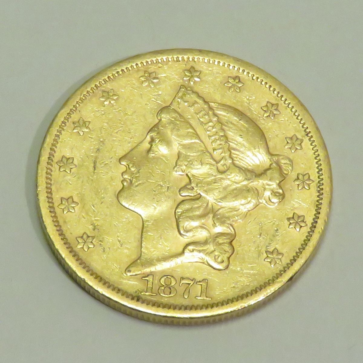 Null 20-D自由头-双鹰金币，日期为1871年，雕刻师：James B.朗克尔。重量：33克45。直径：34毫米。