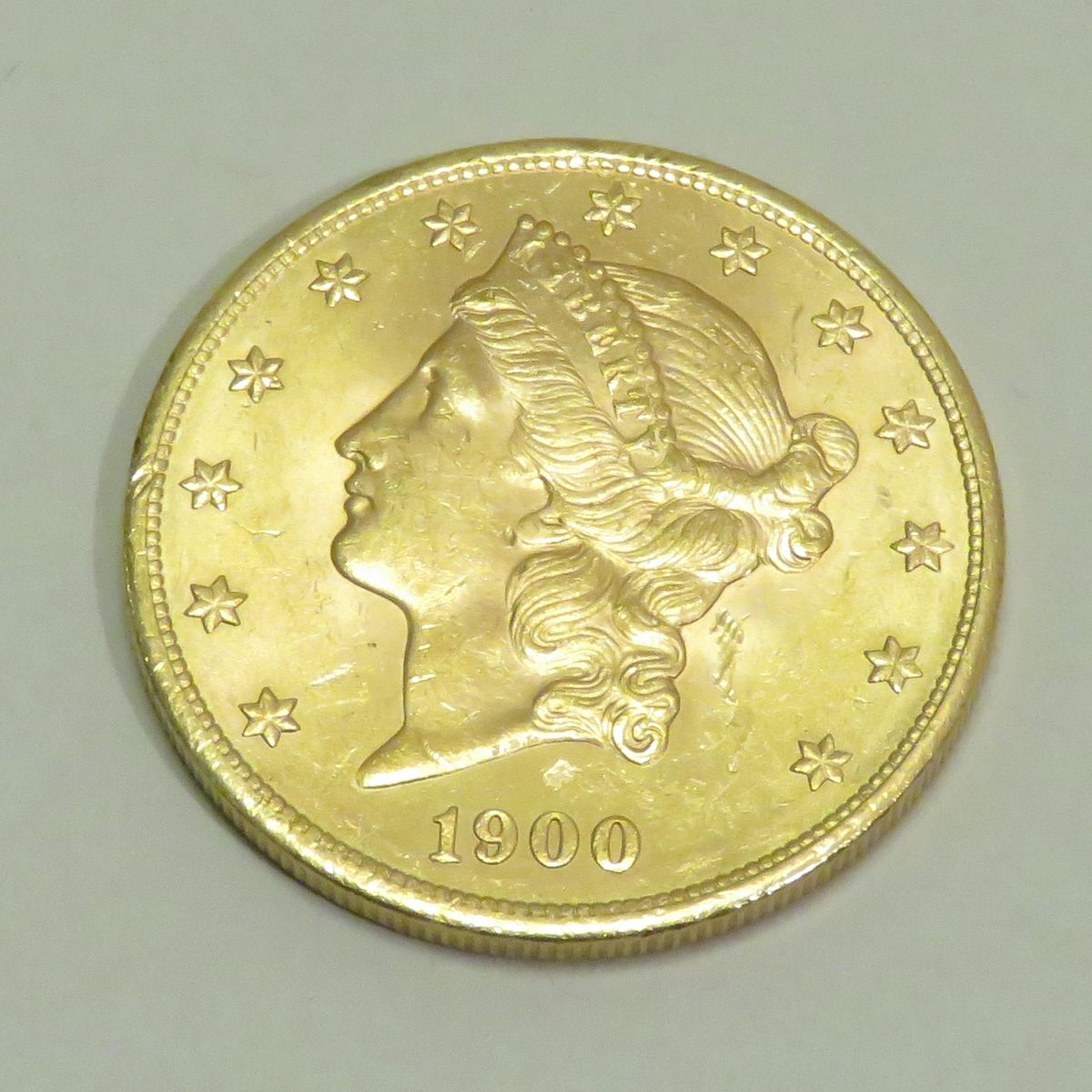 Null 20美元金币 "自由头-双鹰"，日期为1900年，雕刻师：詹姆斯-B。朗克尔。重量：33克45。直径：34mm。