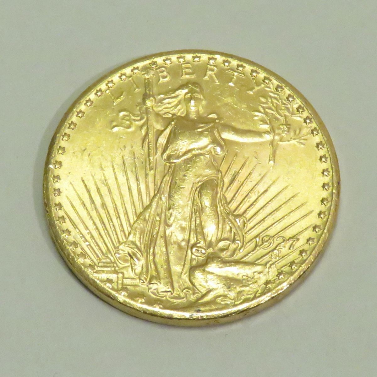 Null 1927年的20美元金币 "自由-圣-高登斯"，雕刻师：奥古斯都-圣-高登斯。重量：33克45。直径：34mm。