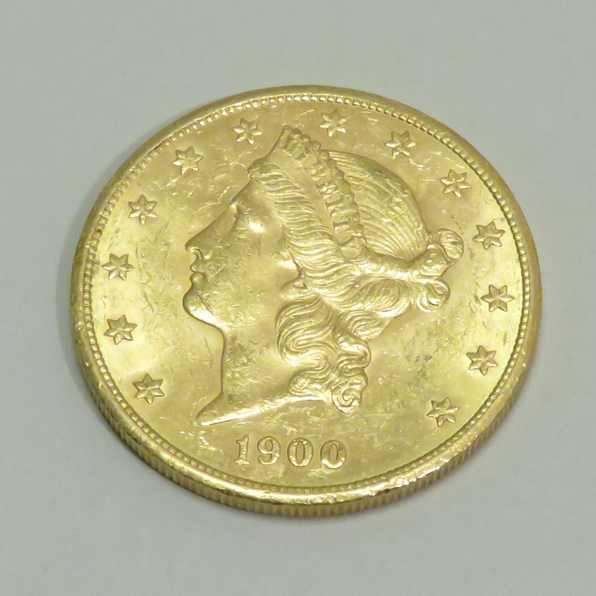 Null 20美元金币 "自由头-双鹰"，日期为1900年，工坊 "S"（旧金山），雕刻师：James B.朗克尔。重量：33克45。直径：34毫米。
