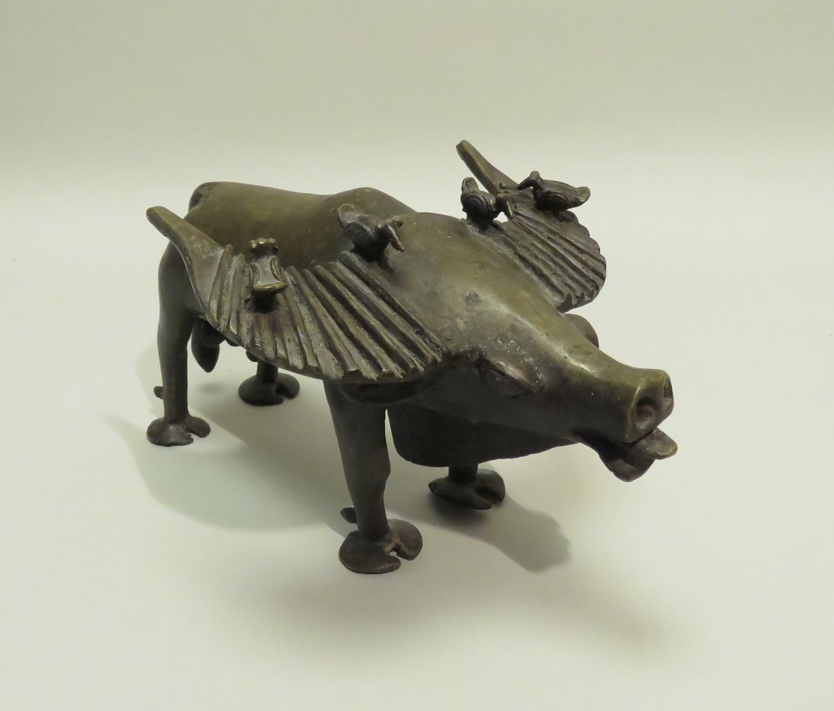 Null Curious bronze sculpture of a buffalo accompanied by four ox-birds. Africa,&hellip;