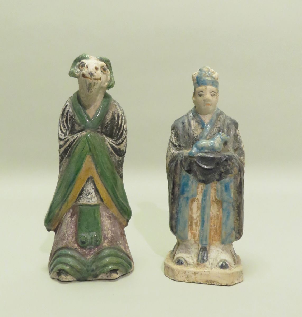 Null Two glazed terracotta subjects, one representing one of the animals of the &hellip;