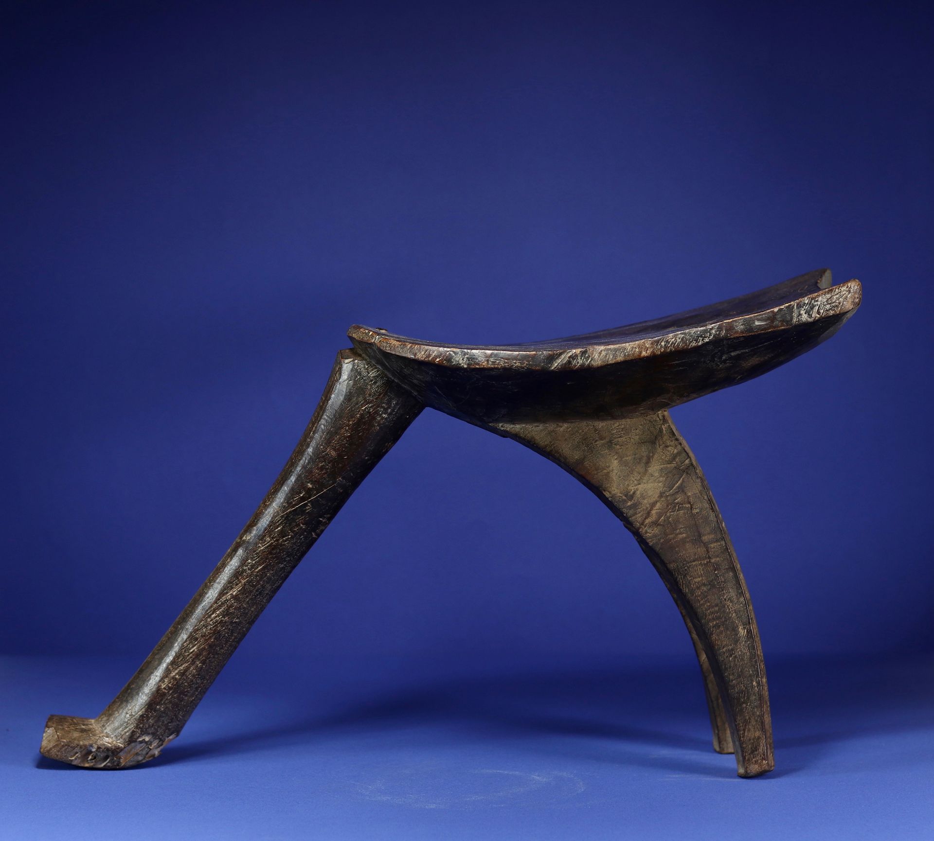 Null 
Tripod stool. 



Wood with a deep patina of use, iron clasp. 



Lobi, Bu&hellip;