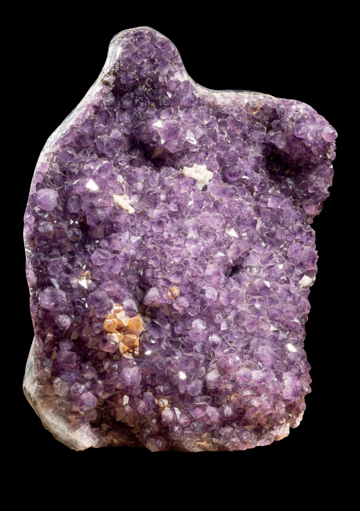 Null Block of amethyst with white calcite crystals.
H. 18 1/2 in - W. 14 9/16 in