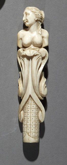 Null 
An ivory parasol handle with a therme in the round.



19th century L. 13,&hellip;