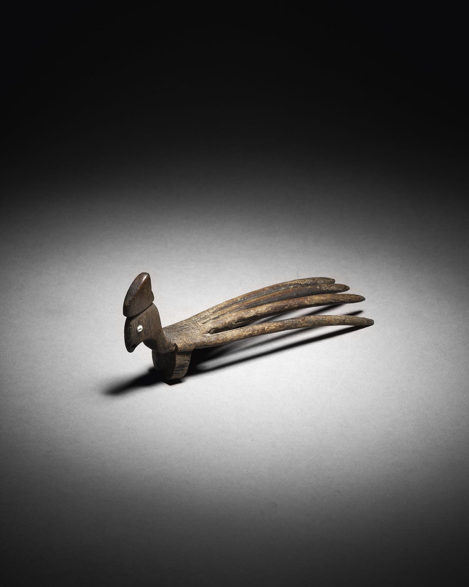Null Kamm mit Hahnenkopf, Indonesien
Holz
L. 23 cm