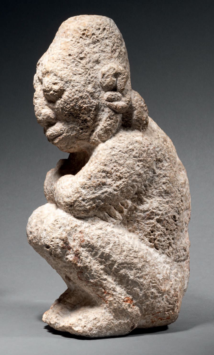 Null Ɵ Maya kneeling captive, Mexico, grey-white limestone
H. 10 5/8 in