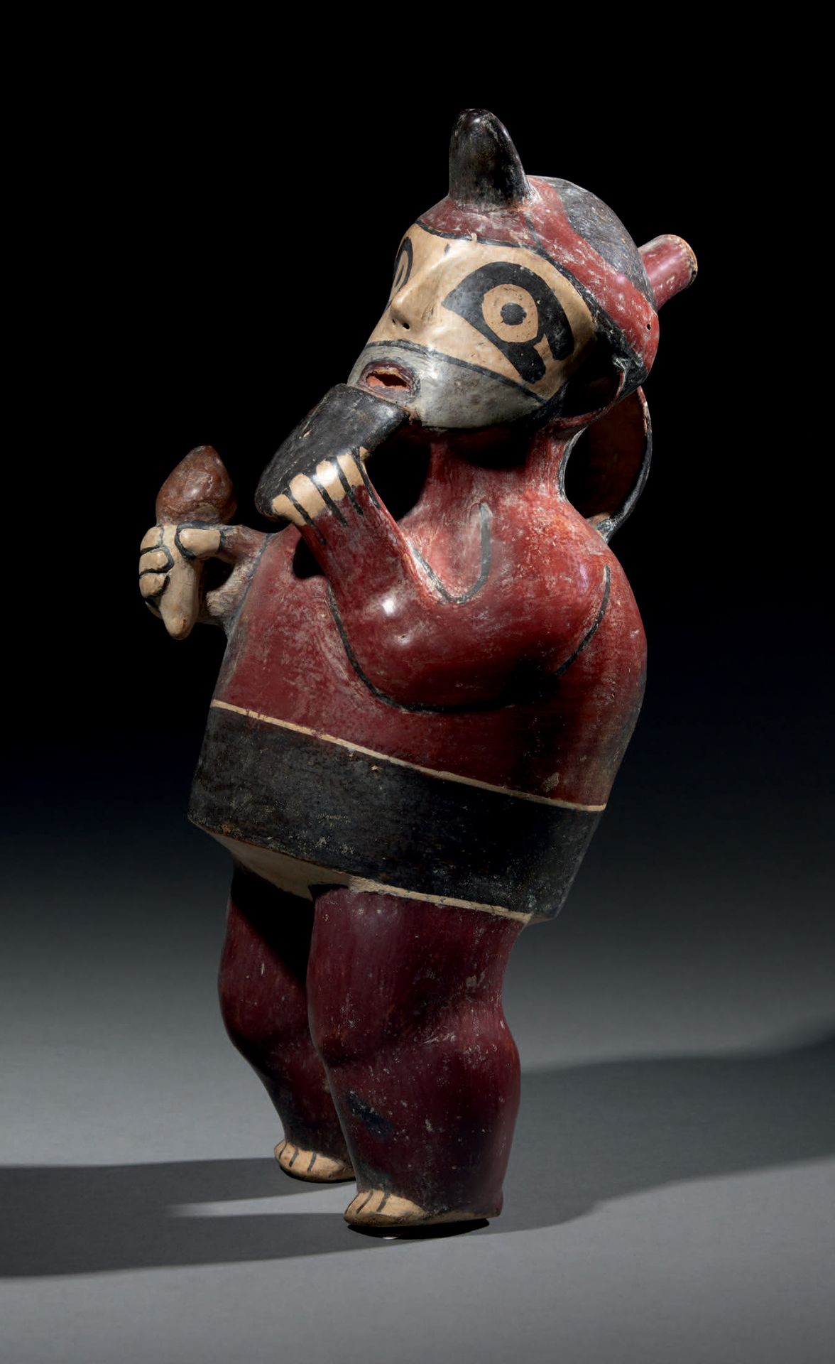 Null Ɵ Nazca effigy vessel of a musician playing the pan pipe, Peru, polychrome &hellip;