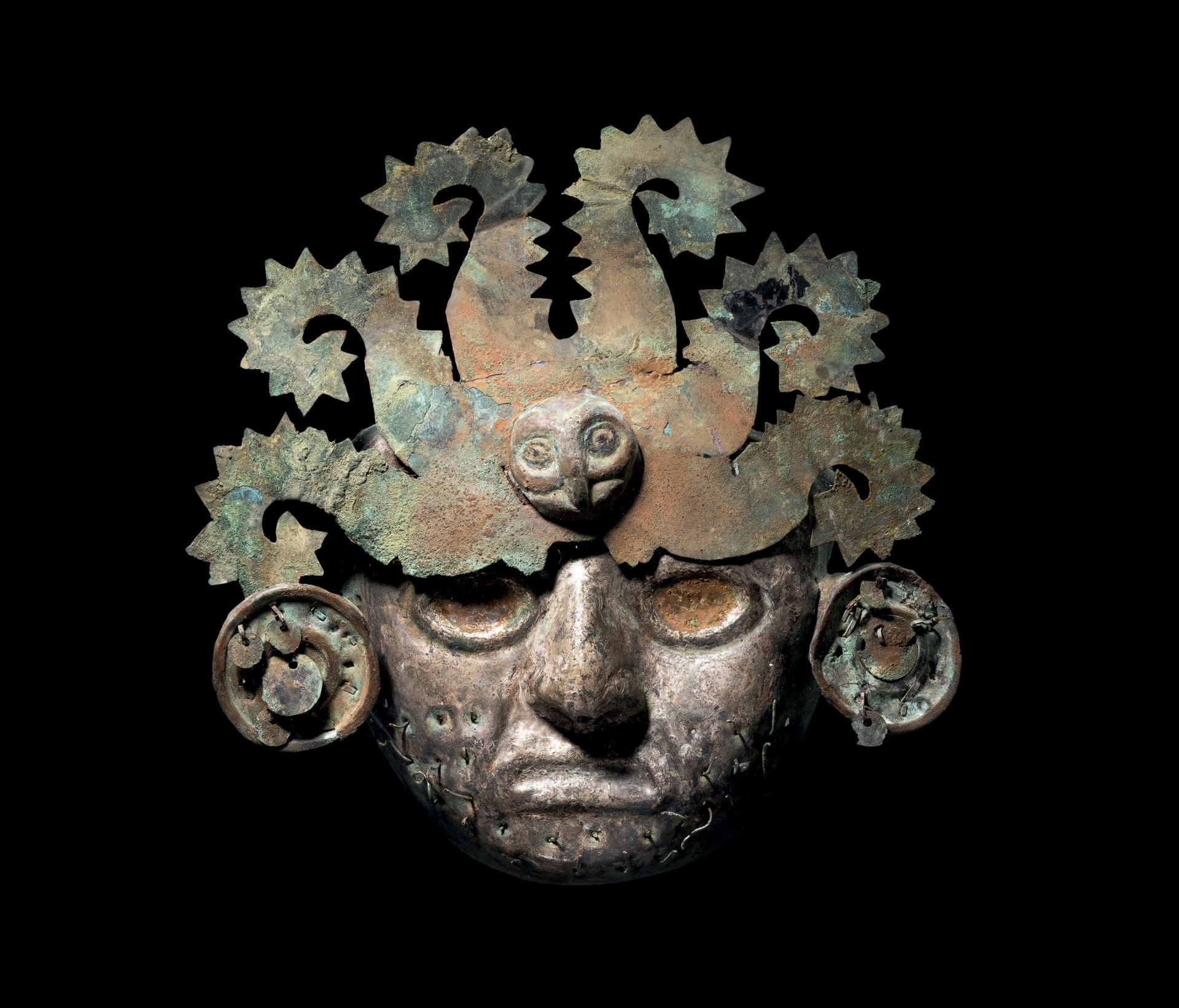 Null Ɵ Moche burial mask, Peru, copper and silver
H. 9 7/16 in - W. 9 3/8 in.