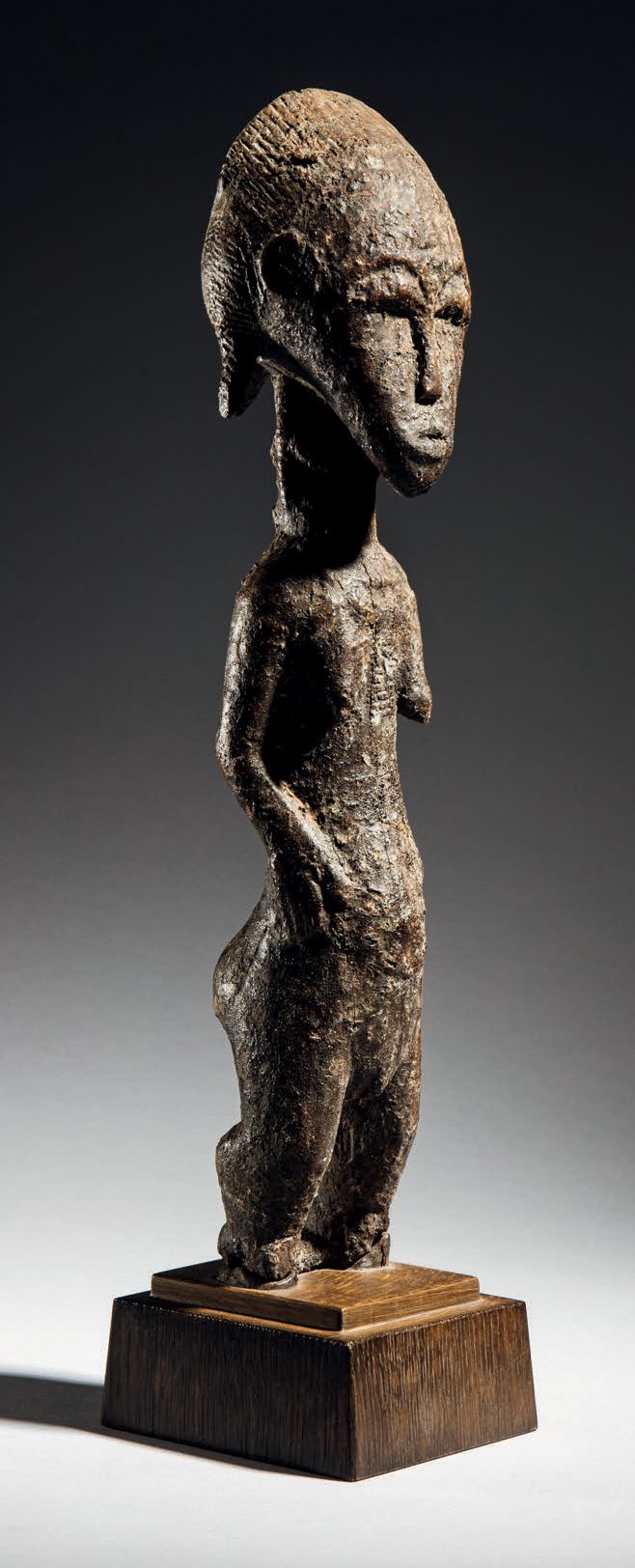 Null - BAULE STATUE, IVORY COAST
Wood
H. 39 cm
Representing a female figure with&hellip;