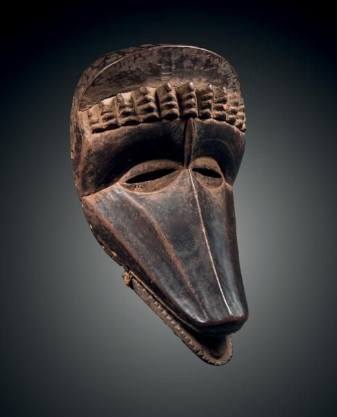 Null Masque Dan, Côte d'Ivoire
Bois dur à patine brun foncé noir
H. 28,5 cm
Dan &hellip;