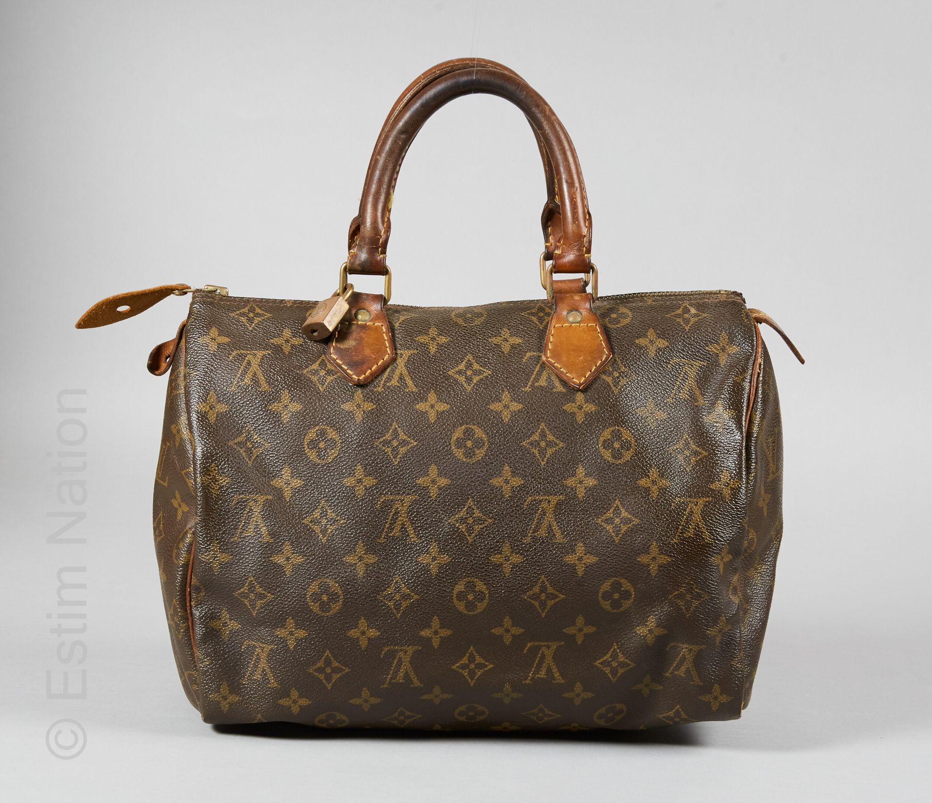 LOUIS VUITTON (1984) BAG "SPEEDY" in Monogram canvas and natural leather, padloc&hellip;