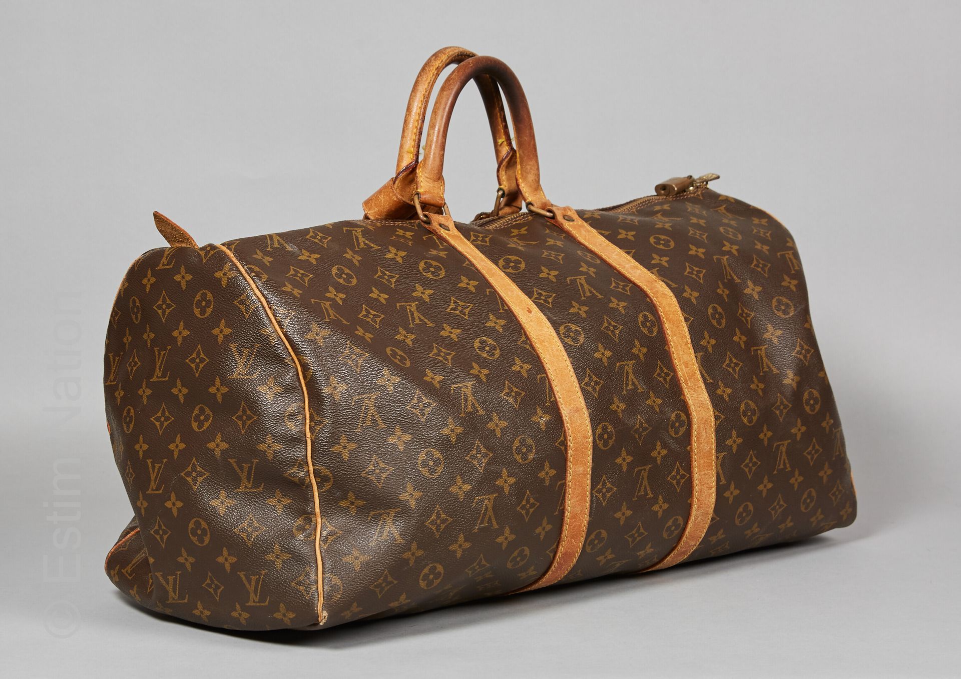 LOUIS VUITTON vintage BAG "KEEPALL 55 CM" in Monogram canvas and natural leather&hellip;