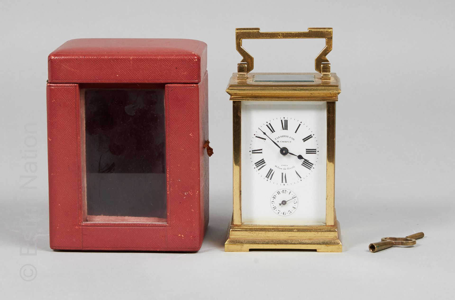 Pendulette de voyage Gilt brass cage travel clock, beveled glass top and sides, &hellip;