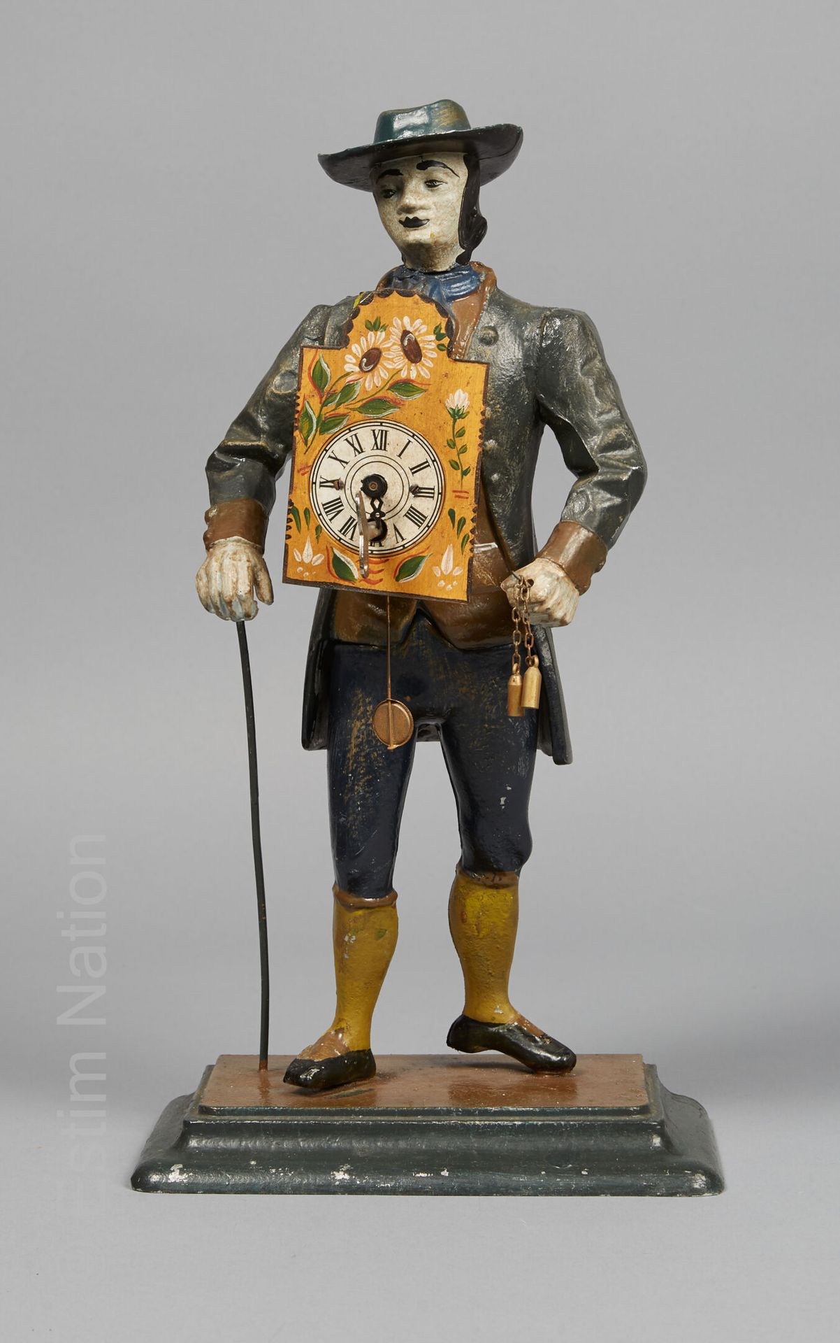 AUTOMATE Polychrome painted regula clock featuring a peddler standing on a base &hellip;