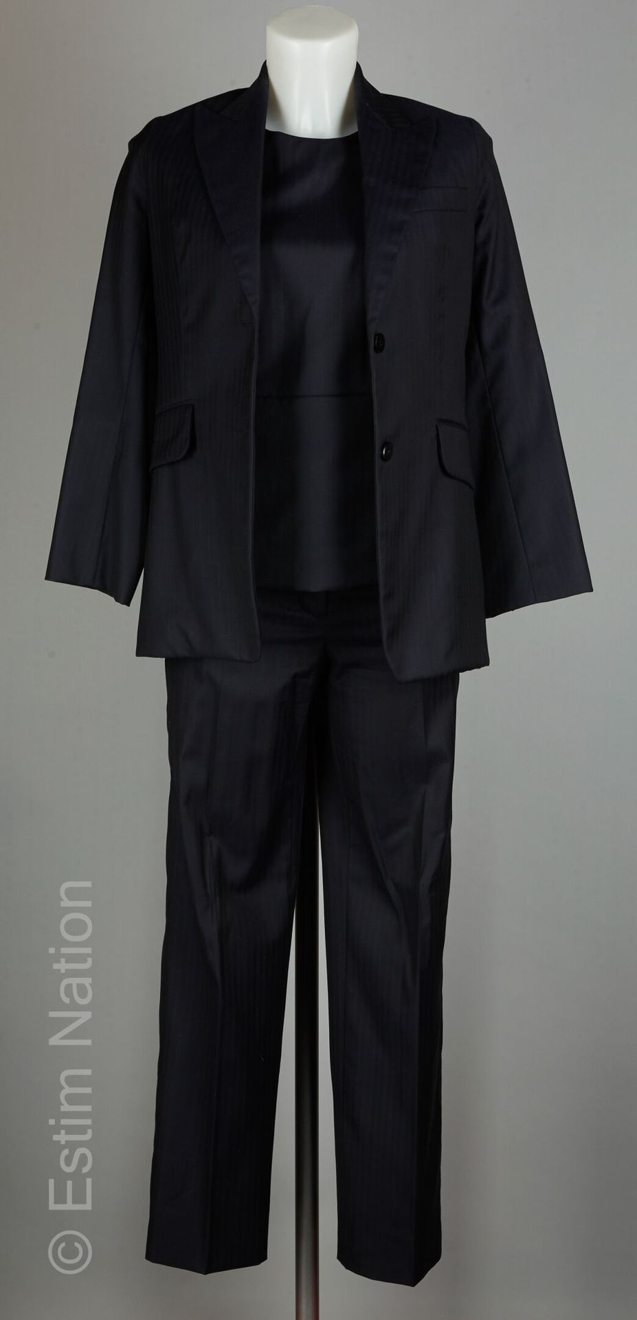 HERMES PAR GAULTIER 墨色条纹三件套，外套、长裤和上衣都有圆形镂空，有签名的衬里（S 34）（微小的痕迹