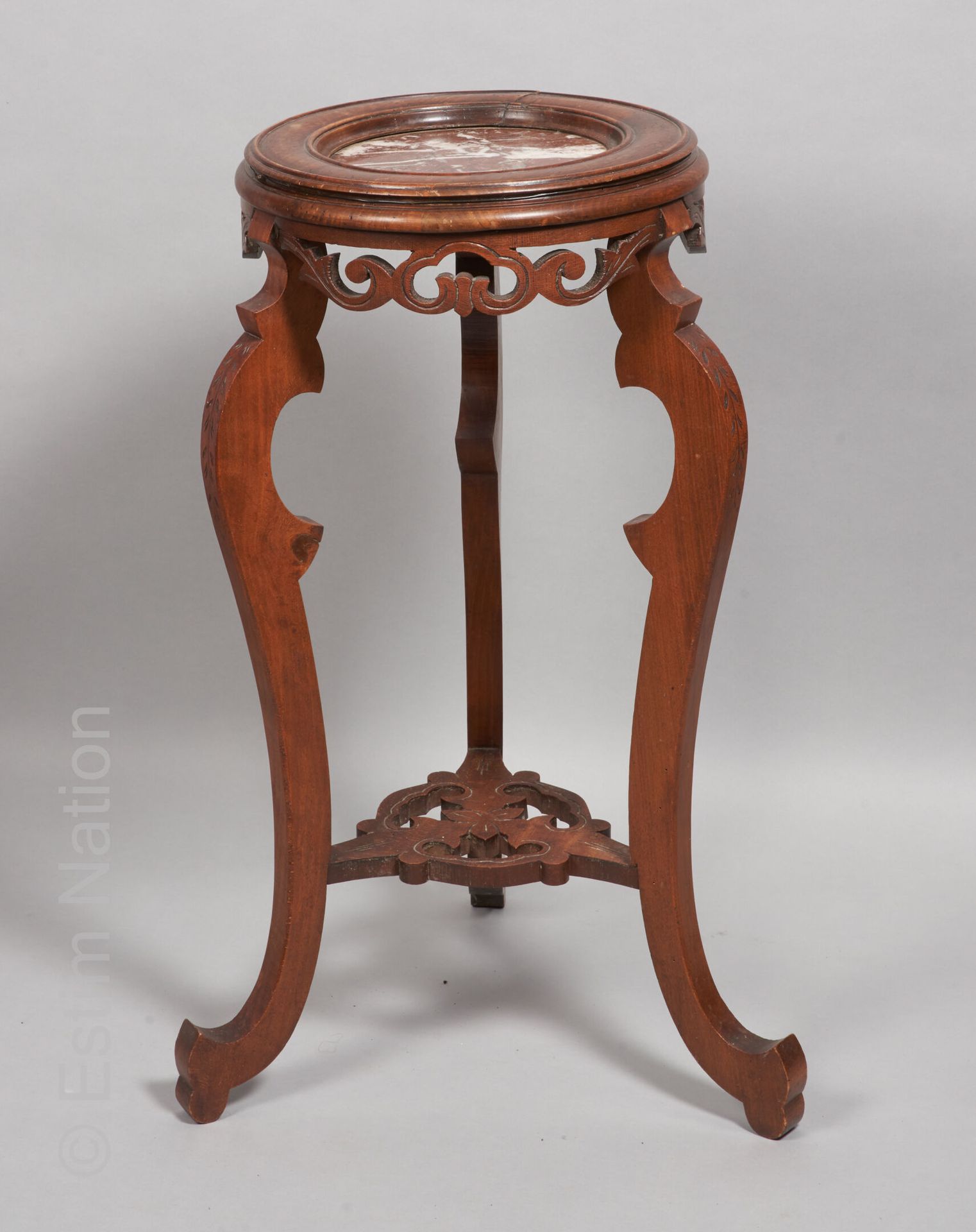 ARTS DECORATIFS XXE SIECLE Walnut sellette with a molded top decorated with a re&hellip;