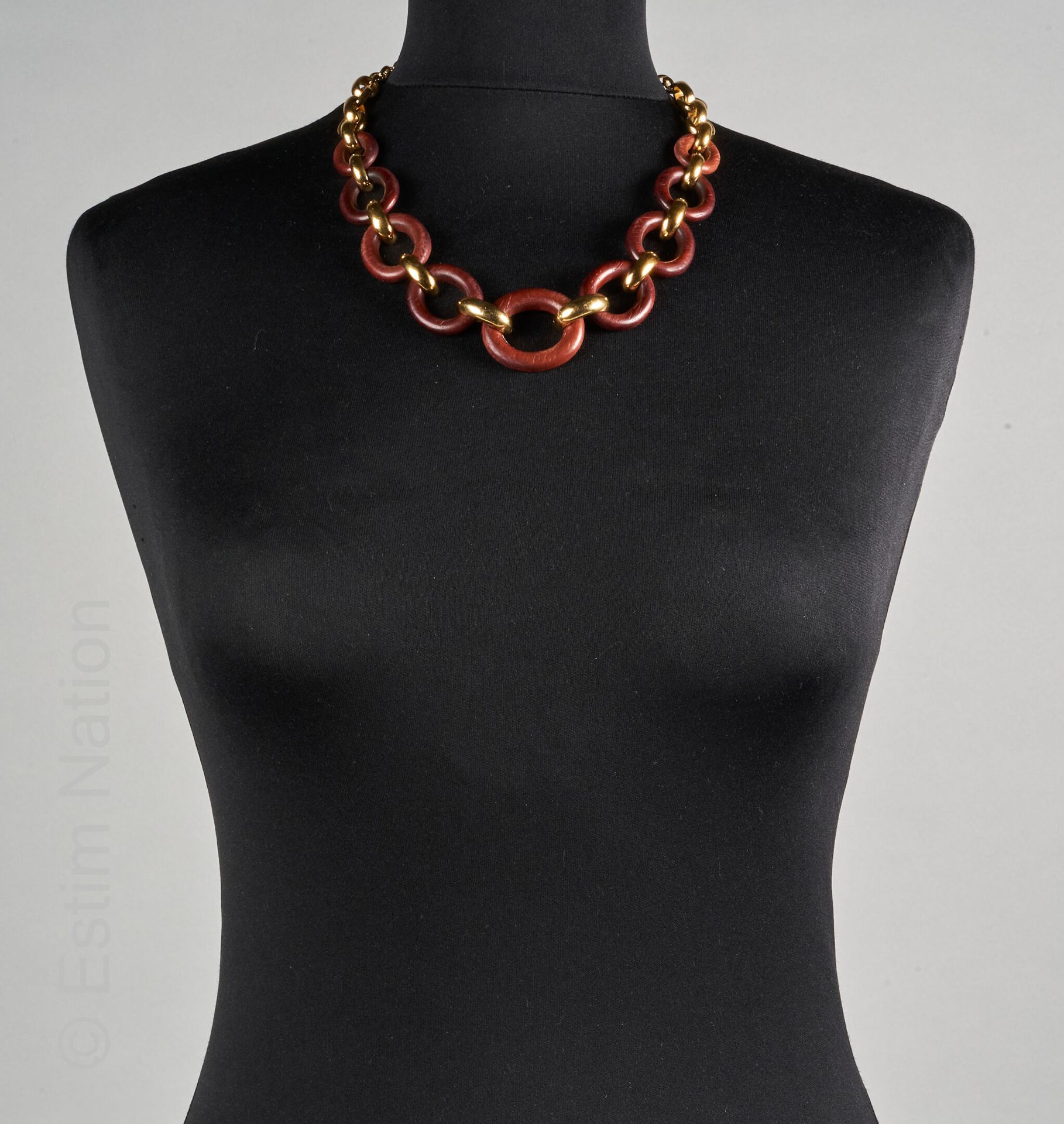 Yves Saint LAURENT NECKLACE link in gilded metal and wood (signed on plate)