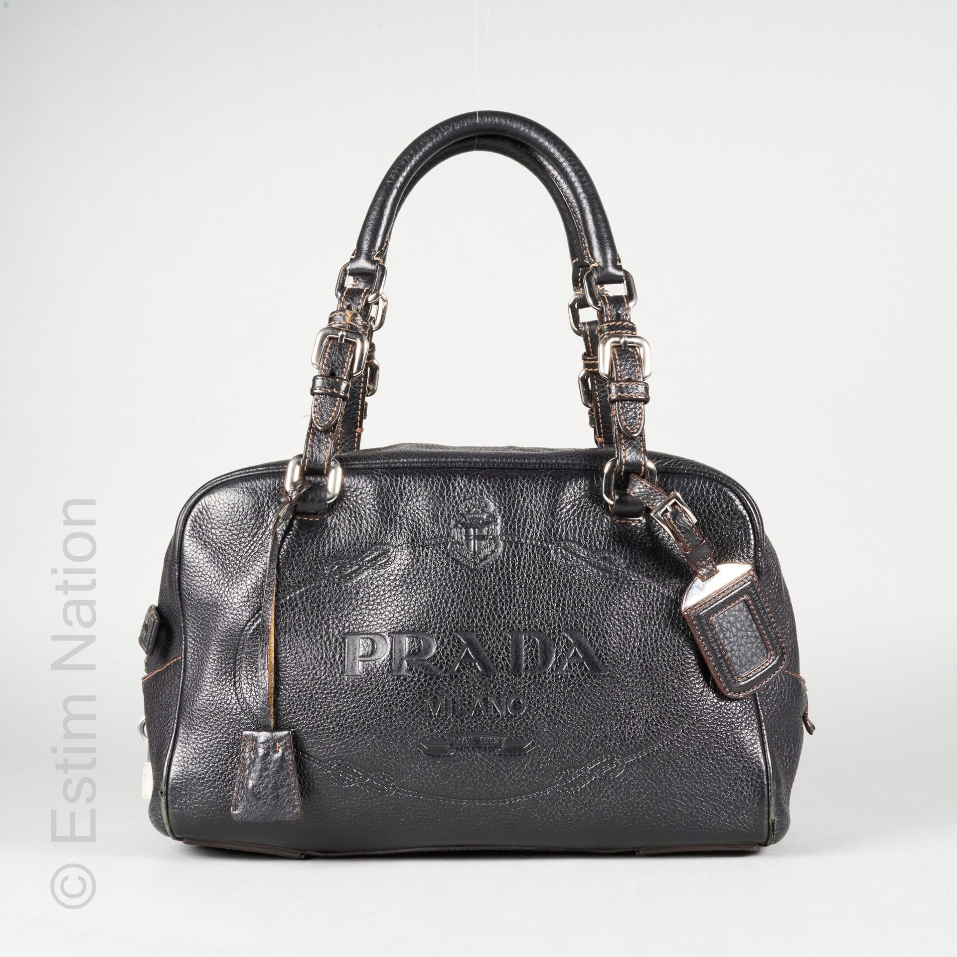 PRADA Rectangular bag in black grained leather stamped with the initials, signed&hellip;