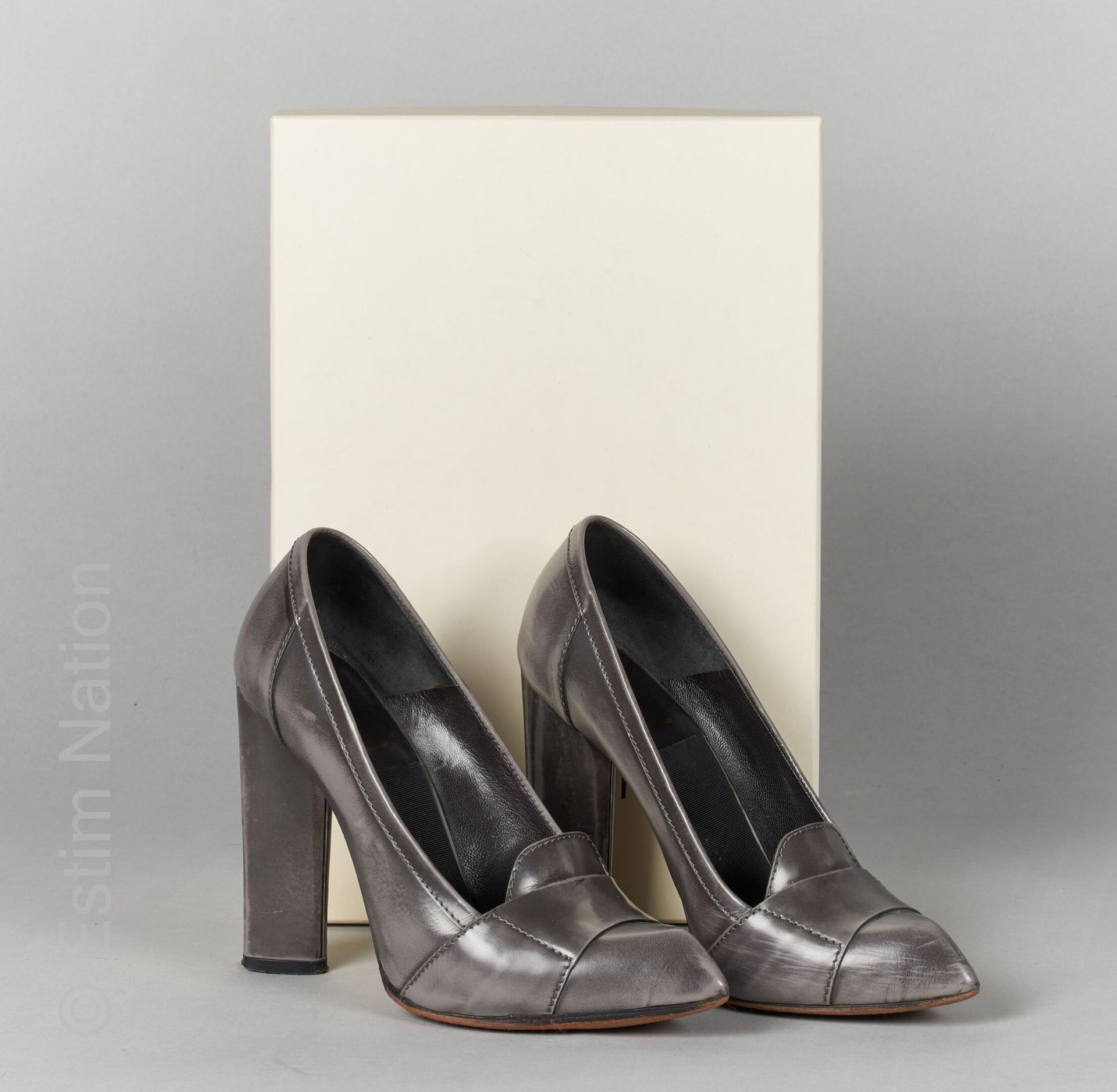 Pair of pointy toe slingbacks in patinated leather with …