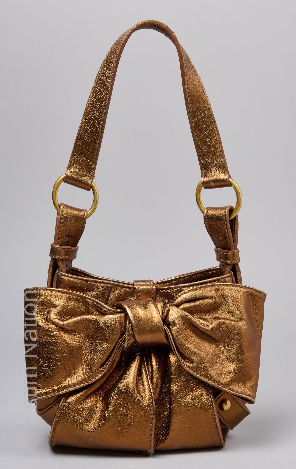 MINI BAG in metallic copper calfskin decorated with a bo… | Drouot.com