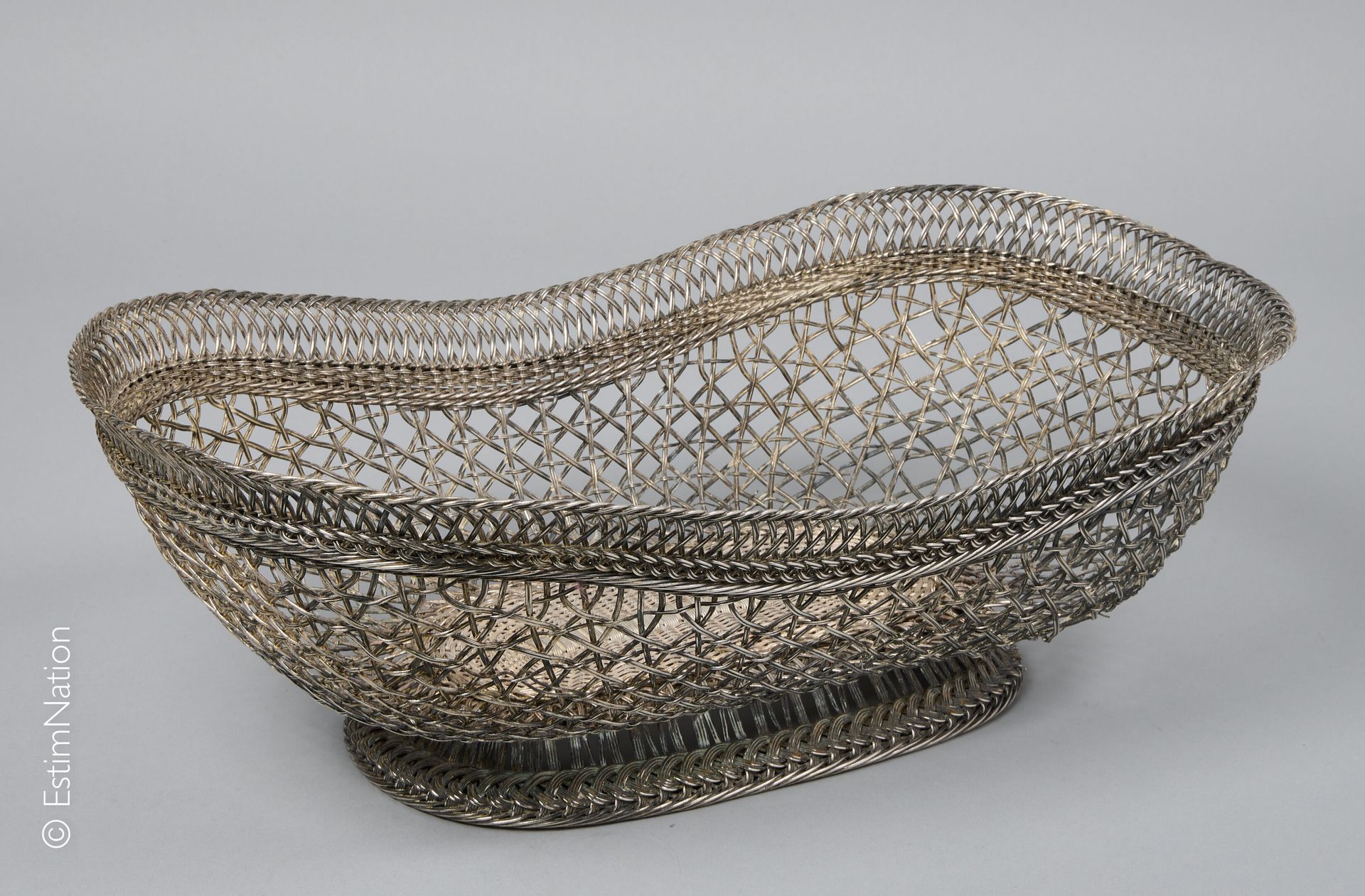 ARGENTERIE Important table basket in woven 925 thousandths silver wire.

20th ce&hellip;