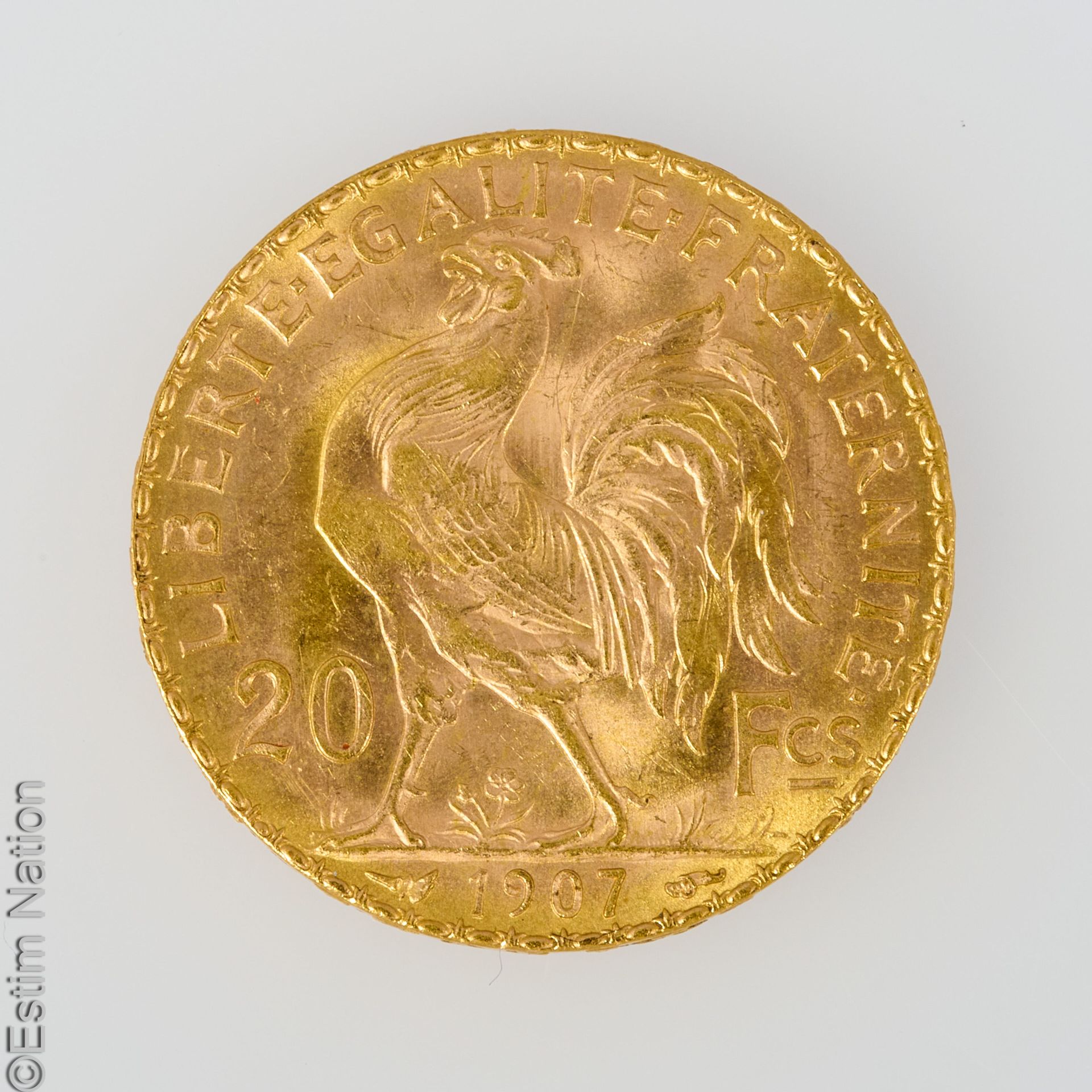 PIECE 20 F OR A twenty franc gold coin, 1907, with rooster. P. 6.4 g.
