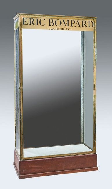 Null Rectangular brass display case with a mirrored back, wooden plinth base. 

&hellip;