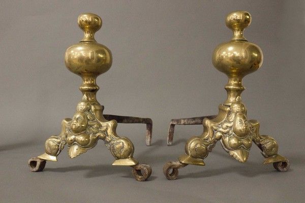 Null Pair of gilt bronze CHENETS with mascaron decoration topped by balusters.

&hellip;