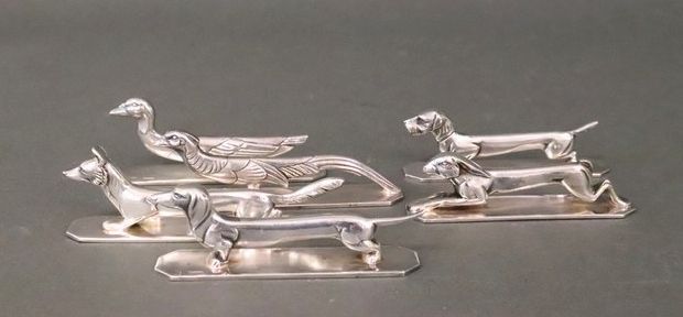 Null SIX PORTE-COUTEAUX en métal argenté représentant des animaux stylisés, sign&hellip;