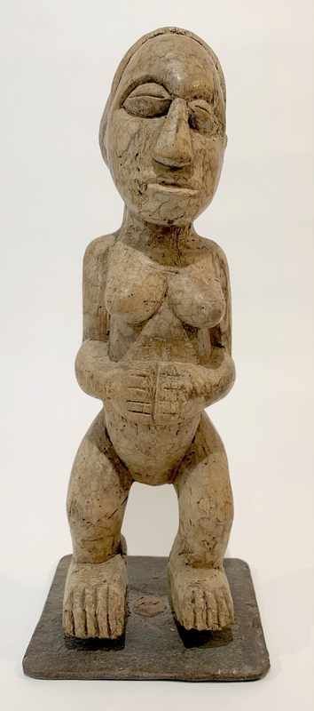 Null Female STATUTE in genuflection, half-closed eyes holding her stomach.
Wood.&hellip;