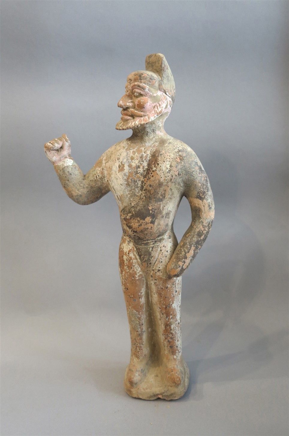 Null Caravaneer in polychrome terracotta with his arm raised, camped in full act&hellip;