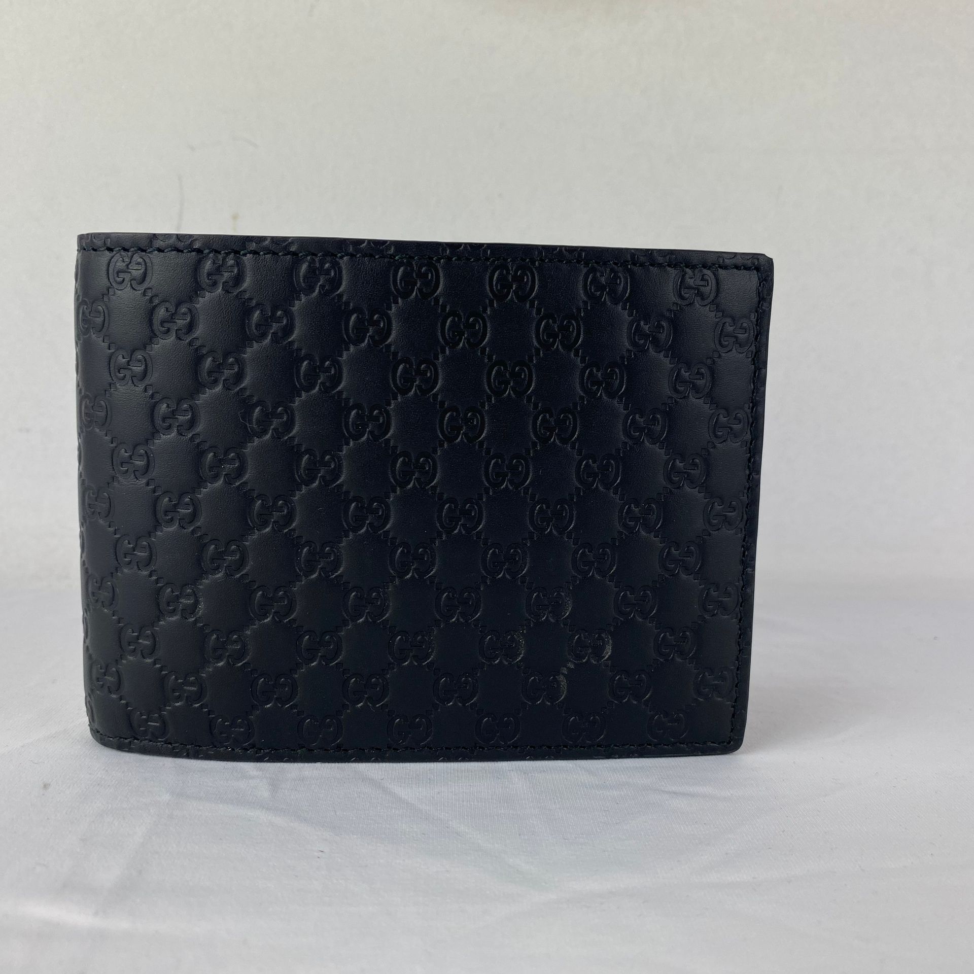 GUCCI A GUCCI Billeteras in black embossed MicroGuggi leather, new with bag