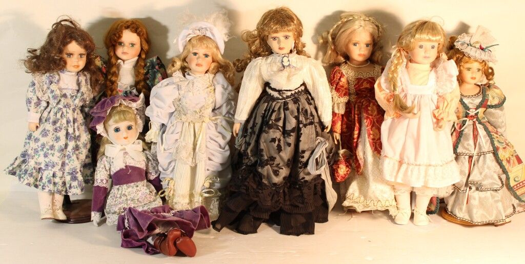 Null Set of 8 porcelain head dolls.