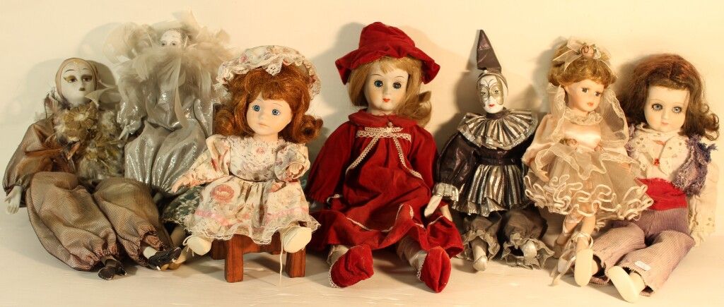 Null Set of 8 porcelain head dolls.