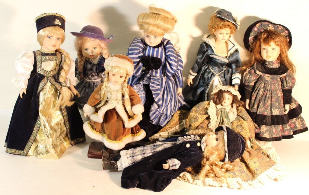 Null Set of 8 porcelain head dolls.