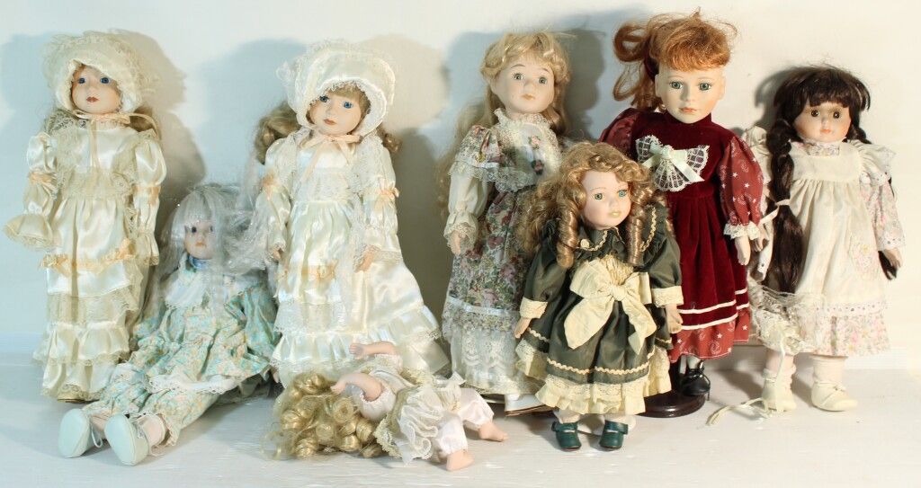 Null Set of 8 porcelain head dolls.