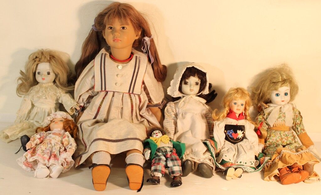 Null Set of 7 porcelain head dolls.