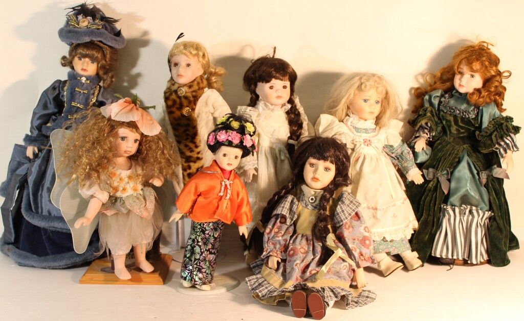 Null Set of 8 porcelain head dolls.