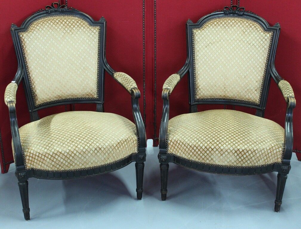 Null Pair of stained wood armchairs in the Louis XVI style.