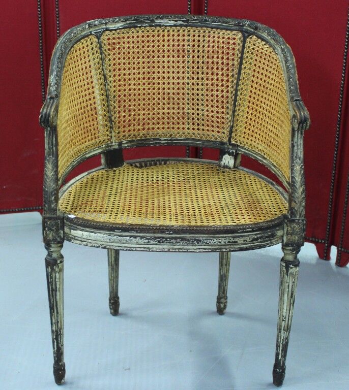 Null Lacquered wood armchair with cane seat and back. Louis XVI period. Accident&hellip;