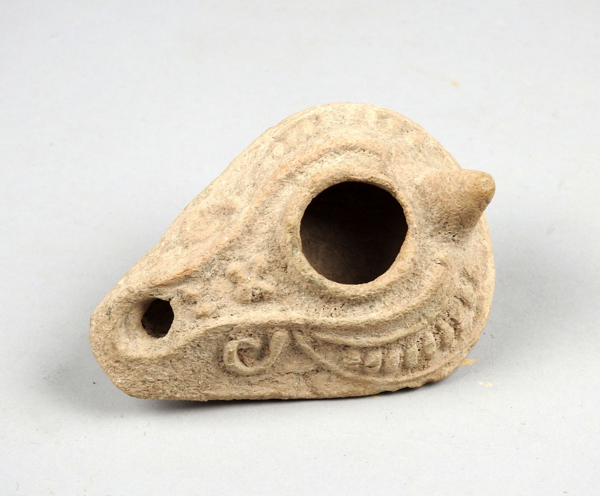 Null Byzantine oil lamp with tenon and cross decoration in relief, potter's mark&hellip;
