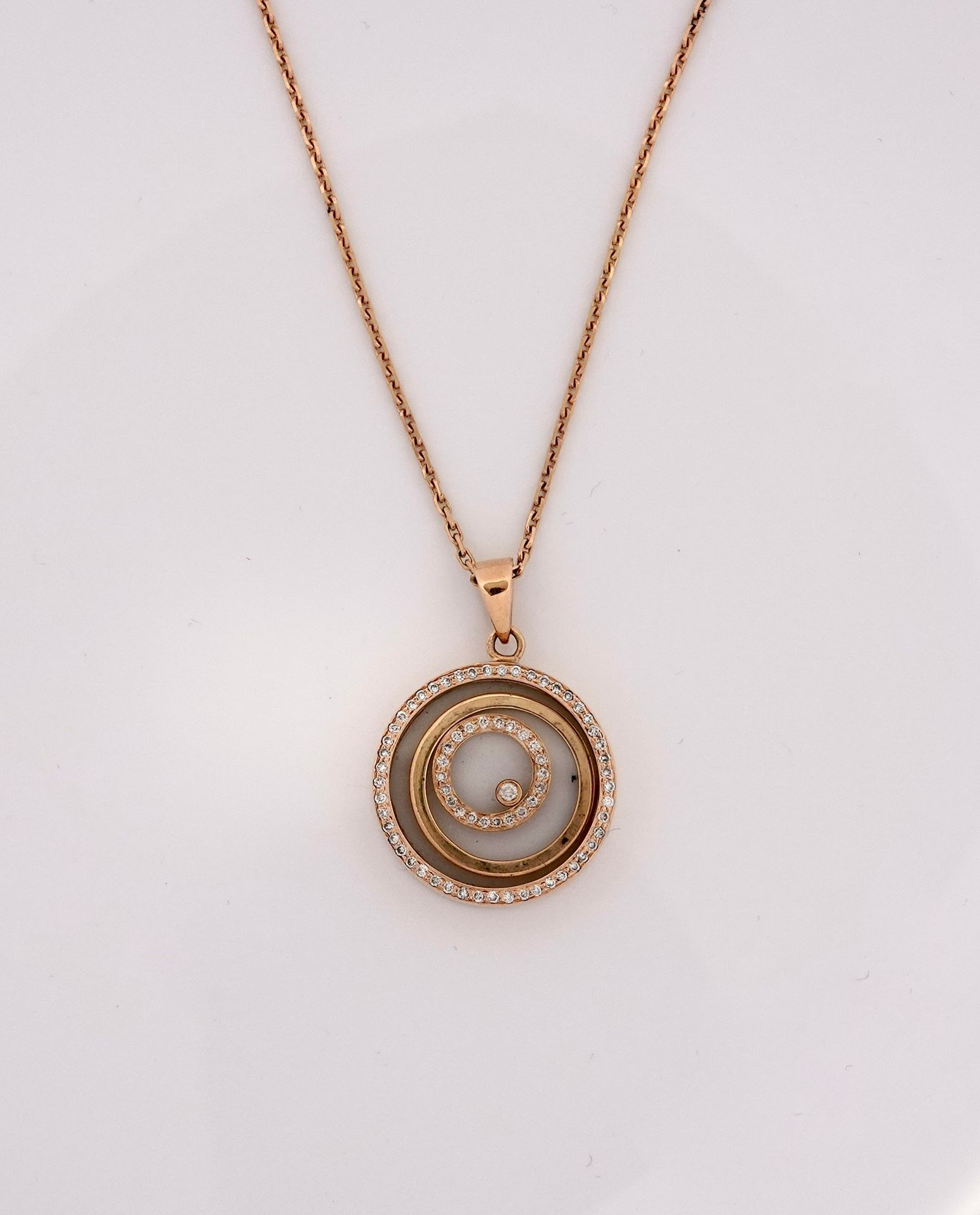 Null Chain and round pendant in yellow gold, 750 MM, decorated with a spiral of &hellip;