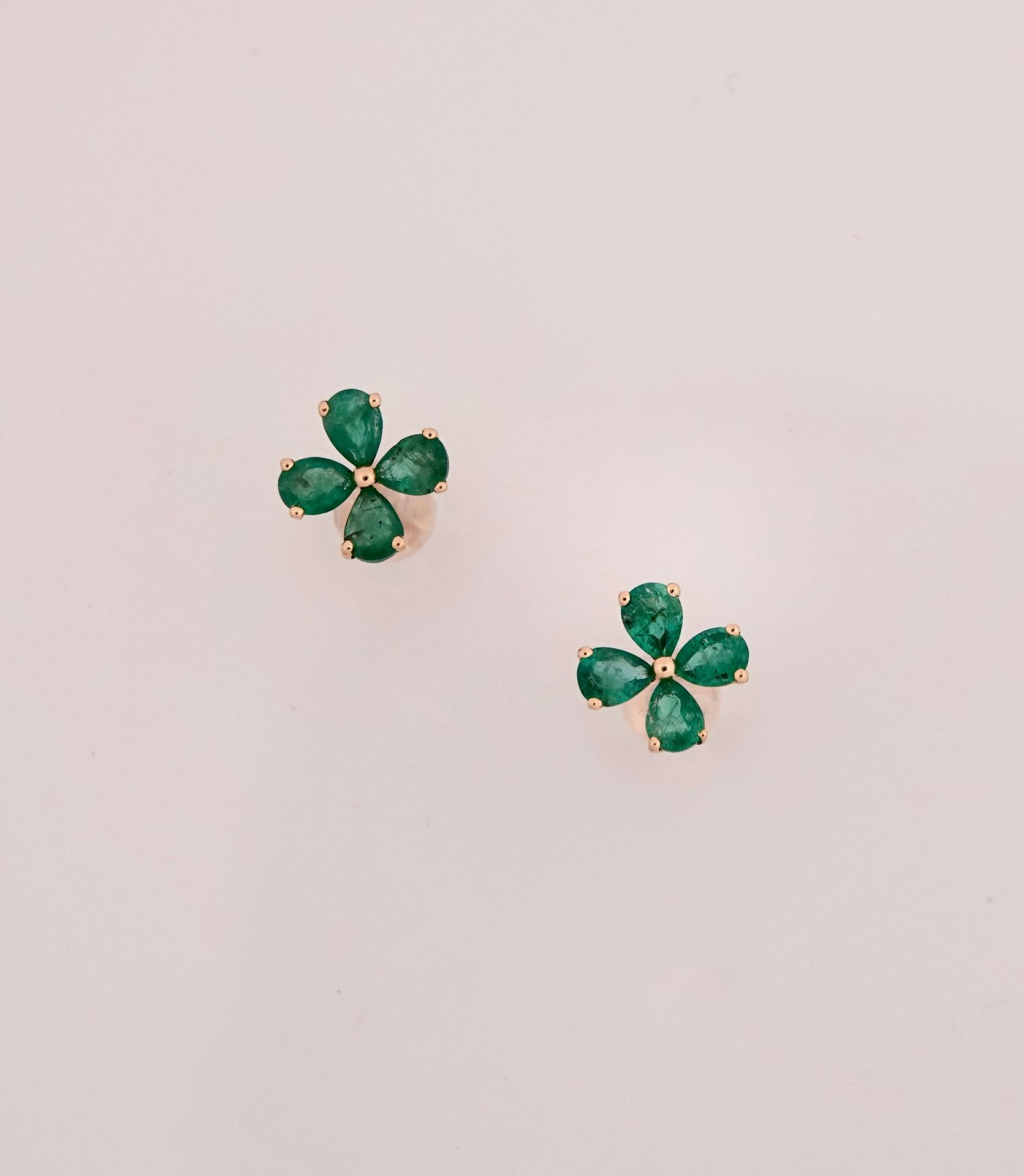 Null Flower earrings in white gold, 750 MM, set with pear-cut emeralds totaling &hellip;