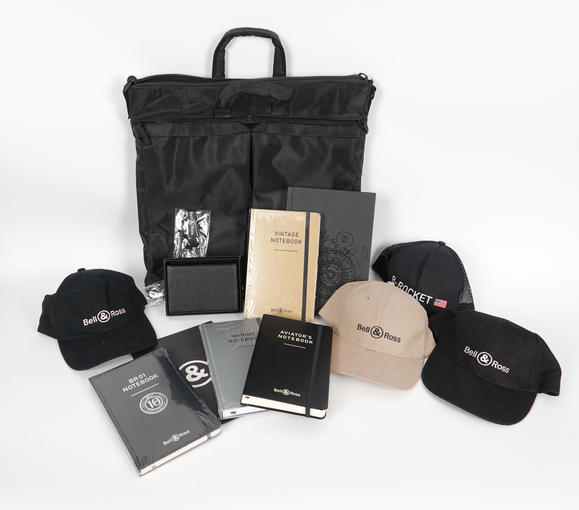 Null A set of Bell & Ross goodies including caps, bags, notebooks ...