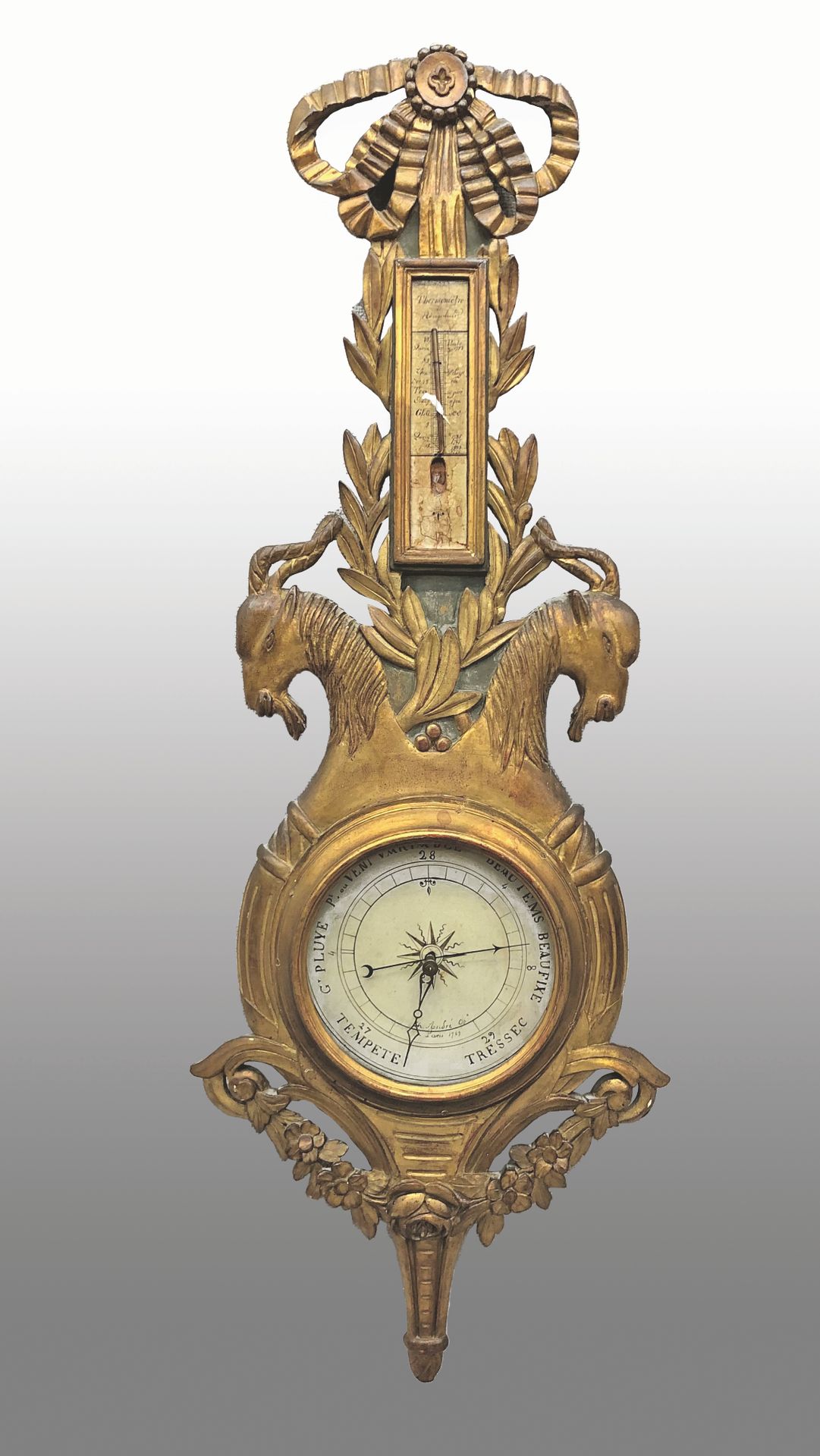 Null 饰有山羊头的鎏金木气压计（部分缺失）。

路易十六风格。

113 x 33 cm